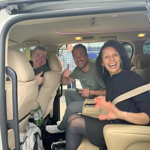 Kristy with clients in the tour vehicle